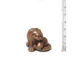 A boxwood netsuke of a tiger By Masataka, early 19th century