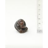 A wood netsuke of a monkey By Tanaka Minko (1735-1816), Tsu, Ise Province, late 18th/early 19th c...