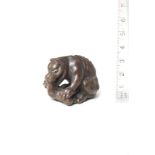 A wood netsuke of a wolf By Tanaka Minko (1735-1816), Tsu, Ise Province, late 18th century