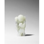 A fine white and grey jade carving of a boy on hobby-horse 17th/18th century