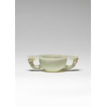 A pale green jade two-handled 'prunus' cup Ming Dynasty (2)