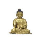 A large gilt copper-alloy repoussé figure of Buddha Shakyamuni Tibet, 17th century