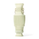 A very pale green jade archaistic vase, hu Qianlong