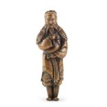 A tall wood netsuke of Kan'u Edo period (1615-1868), late 18th century