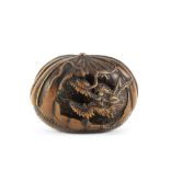 A netsuke of a dragon in a chestnut By Toyoyasu (Toyoyo), Edo period (1615-1868), Sasayama, Tanba...