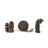 Three wood netsuke and one stag-antler kiseruzutsu (pipe case) Edo period (1615-1868), early to ...