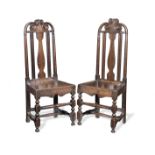 A pair of late 17th century oak chairs (2)