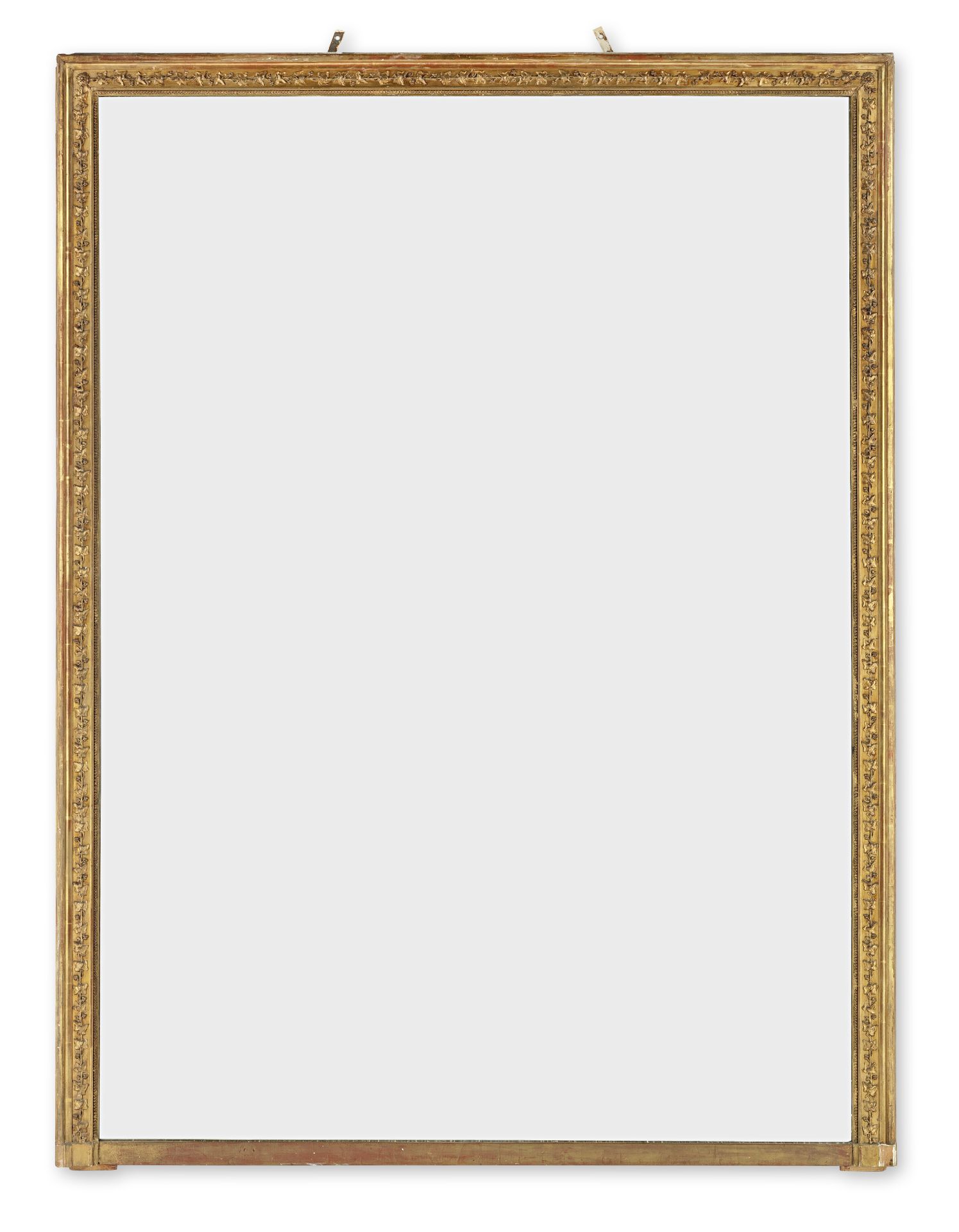 A large late 19th century carved giltwood and gesso overmantel mirror