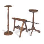 An elm and wrought iron roasting spit together with an 18th century oak candle or urn stand and a...