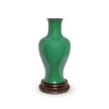 A large Chinese green-glazed baluster trumpet-necked vase