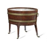 A George III mahogany and brass bound wine cooler on stand