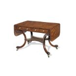 A Regency mahogany sofa table In the manner of Gillows