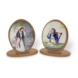 A pair of late 18th century oval enamel plaques