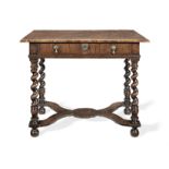 An early 18th century elm and walnut side table