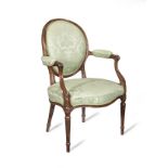 A George III mahogany armchair in the French taste
