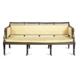 A Regency ebonised and parcel gilt sofa