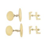 A pair of cufflinks and a pair of gold cufflinks