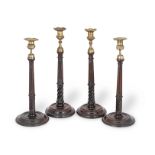 Two similar pairs of George III mahogany candlesticks (4)