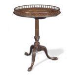 A George III and later mahogany tripod table