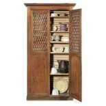 A French 19th century cherry wood kitchen cupboard containing a collection of vintage kitchenalia...