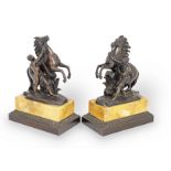 A pair of bronze Marley horses on marble base