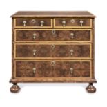 A walnut, fruitwood, oyster veneered and boxwood strung chest of drawers William and Mary and later
