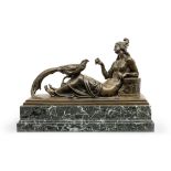 Ferdinand Liebermann (German, 1843-1941) A bronze of a Greek maiden feeding a pheasant whilst rec...