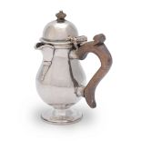 A Queen Anne silver hot milk jug William Fawdery, London 1706