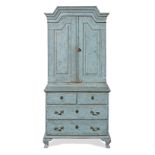 A Scandinavian early 19th century blue painted pine cabinet on chest