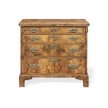 A George I walnut crossbanded and feather banded bachelor's chest