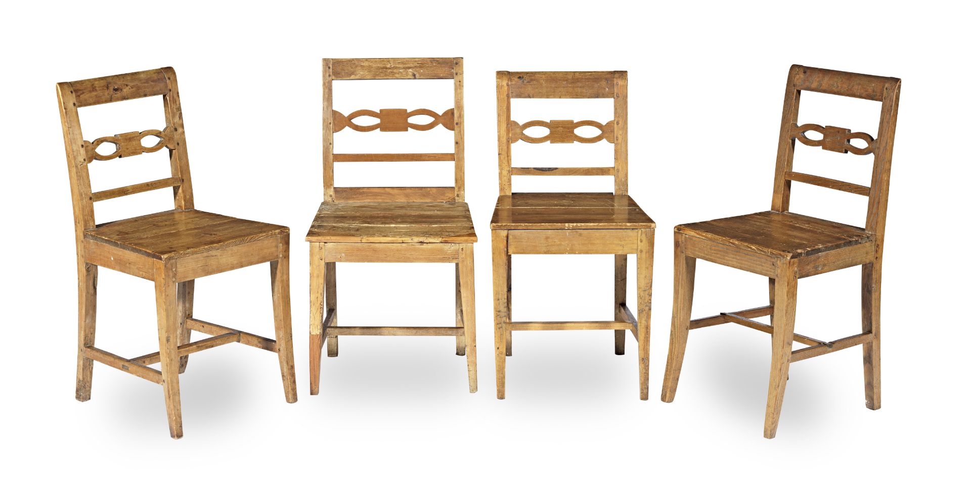 A set of four 19th century pine kitchen chairs