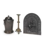 A Victorian cast metal pricket candlestick together with a cast iron fire back and a painted tole...