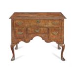 A George II walnut, cross banded and chequer banded lowboy