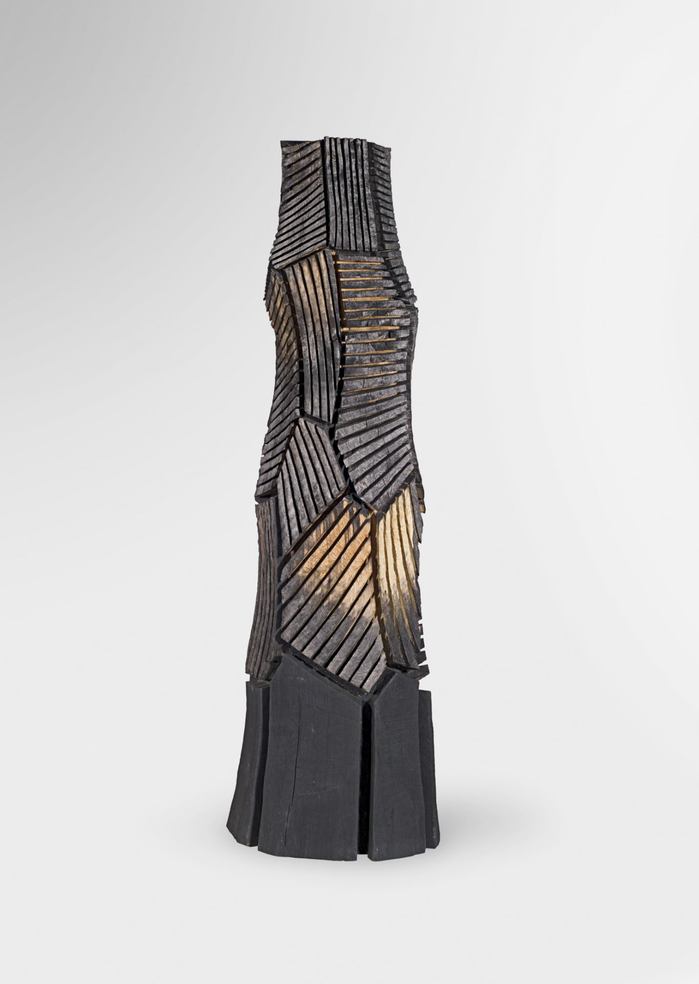 David Nash R.A. (British, born 1945) Multi-cut Column 261.6 cm. (103 in.) high (Executed in 2001)