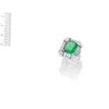 AN EMERALD AND DIAMOND RING,