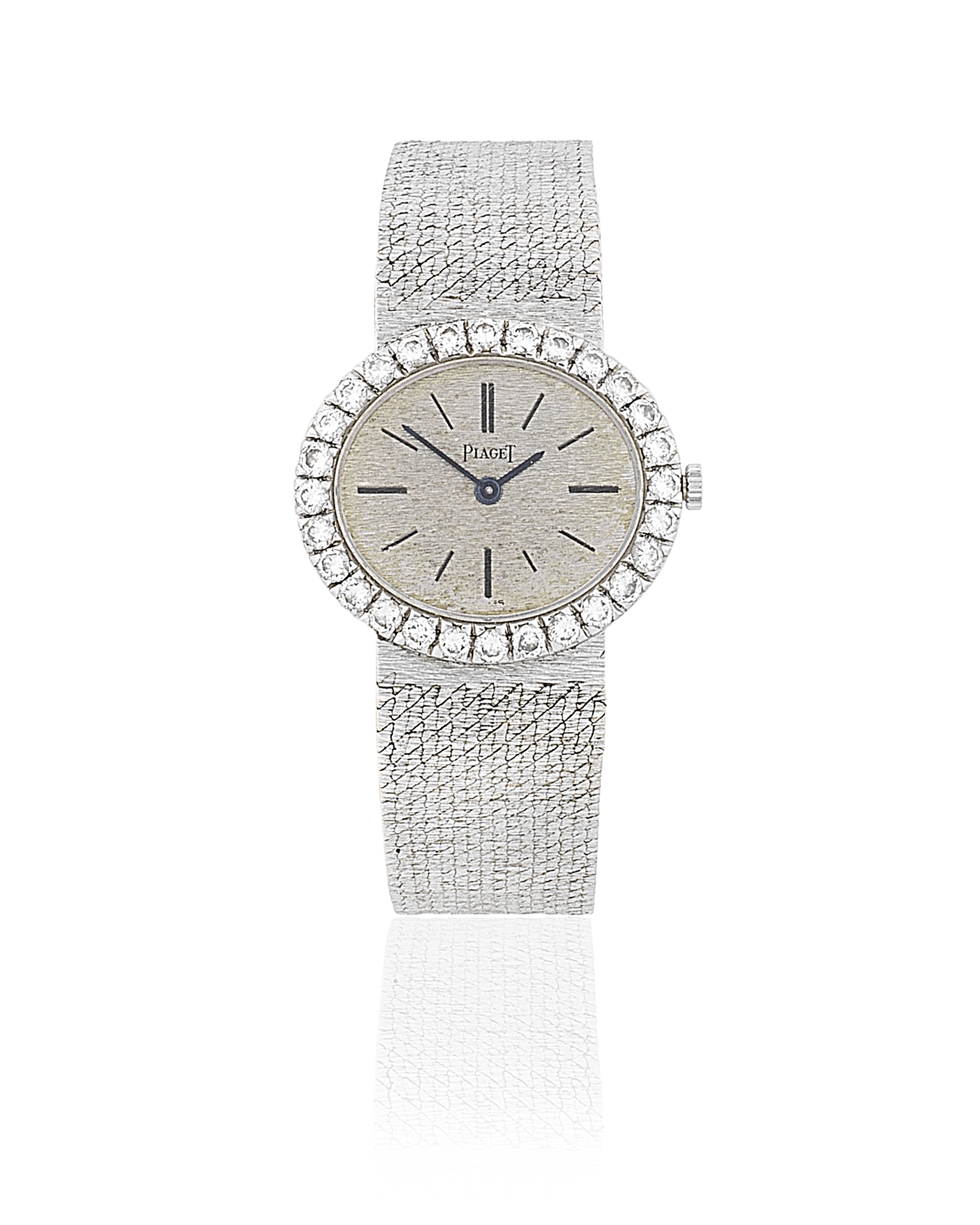 Piaget. A lady's 18K white gold and diamond set manual wind bracelet watch Ref: 9804, Circa 1975