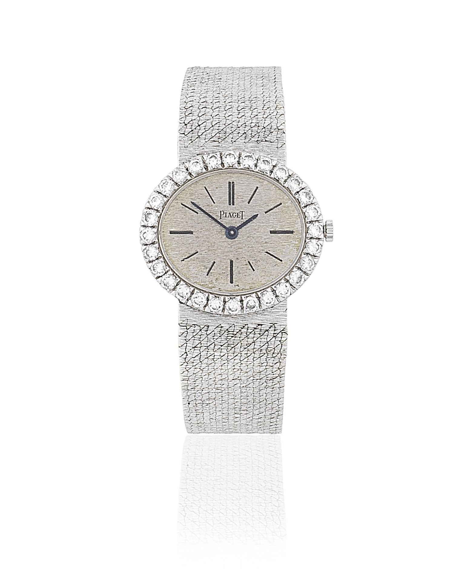 Piaget. A lady's 18K white gold and diamond set manual wind bracelet watch Ref: 9804, Circa 1975
