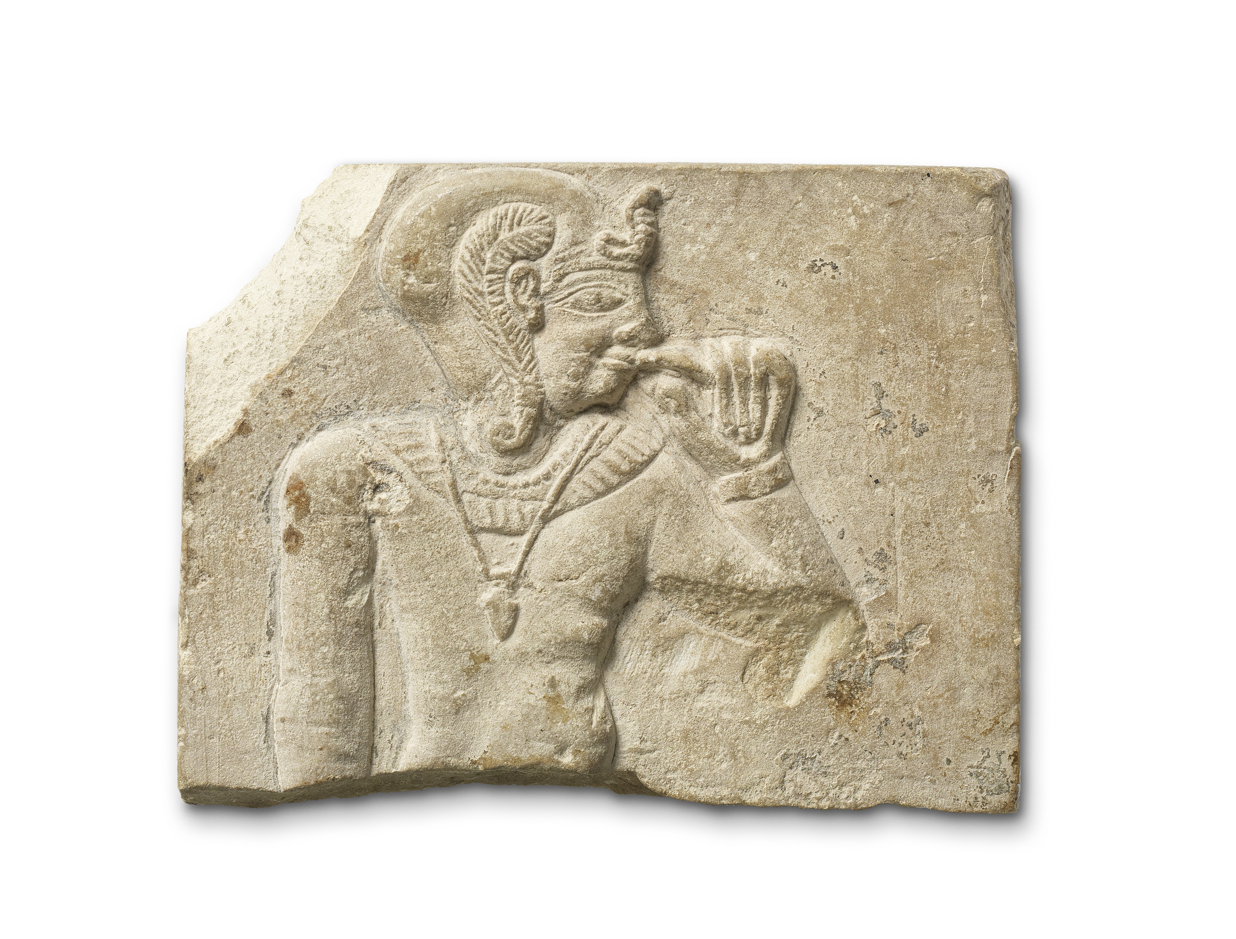 An Egyptian limestone sculptor's model with Harpocrates