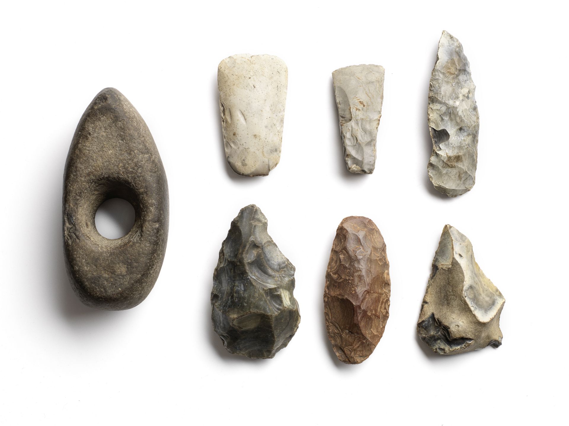 A group of four Palaeolithic and three Neolithic stone and flint implements 7