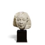 An Egyptian limestone head of a pharaoh