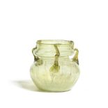 A Roman olive green glass jar