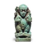 An Egyptian turquoise glazed composition Pataikos cippus amulet