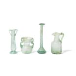 Four Roman green glass vessels 4