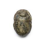 An Egyptian mottled green stone heart scarab