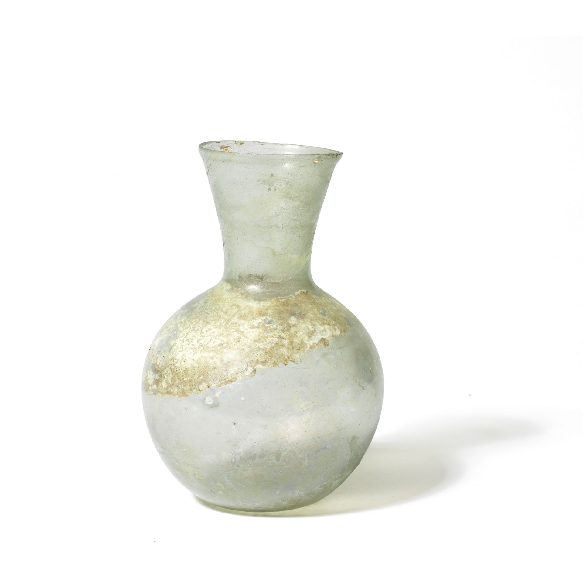 A Roman pale green glass flask