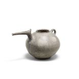 An Iranian grey-ware pottery spouted jar