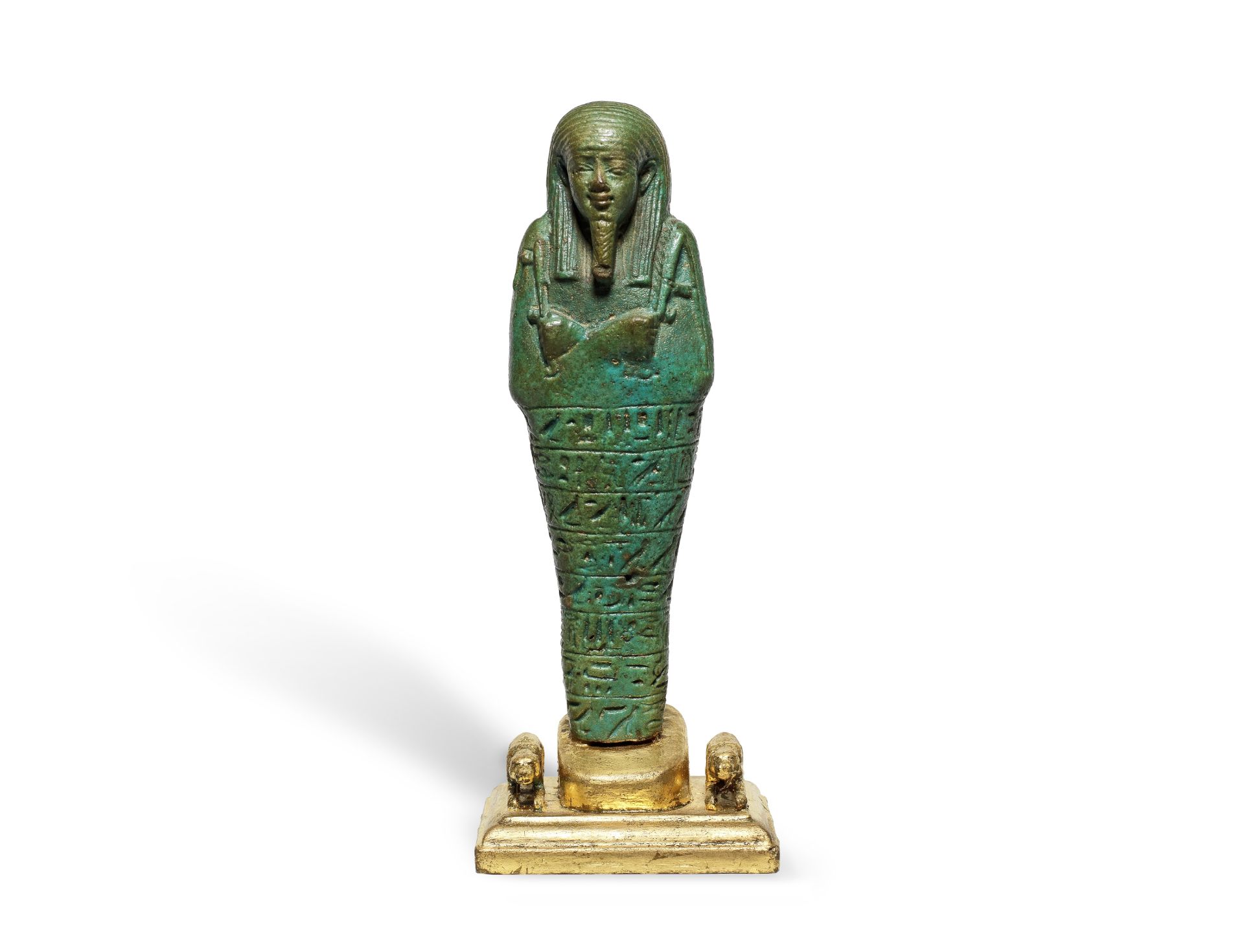 An Egyptian turquoise glazed composition shabti