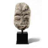 A Celtic limestone head of a deity, probably Cernunnos