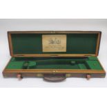 A brass-mounted oak and leather single guncase by Purdey (3)