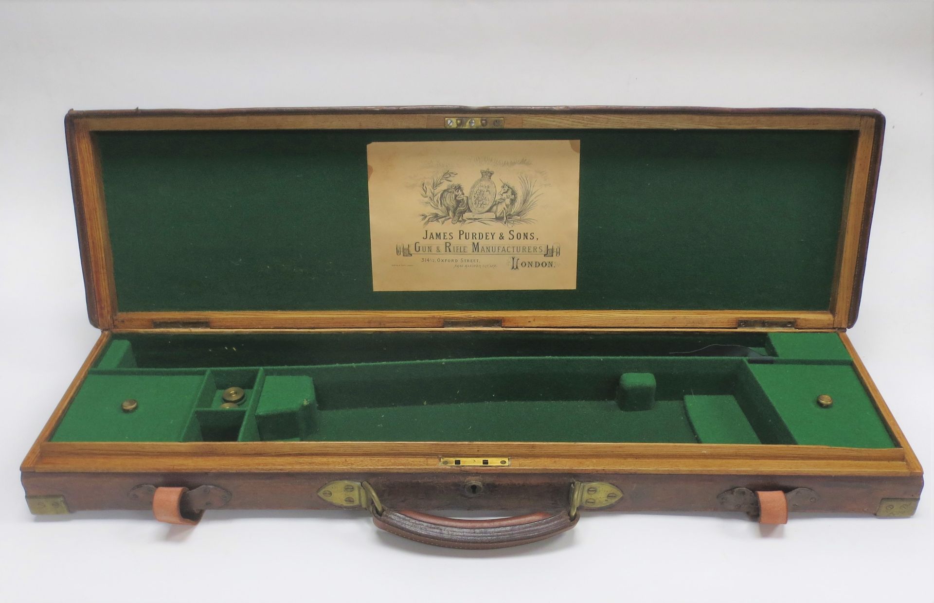 A brass-mounted oak and leather single guncase by Purdey (3)